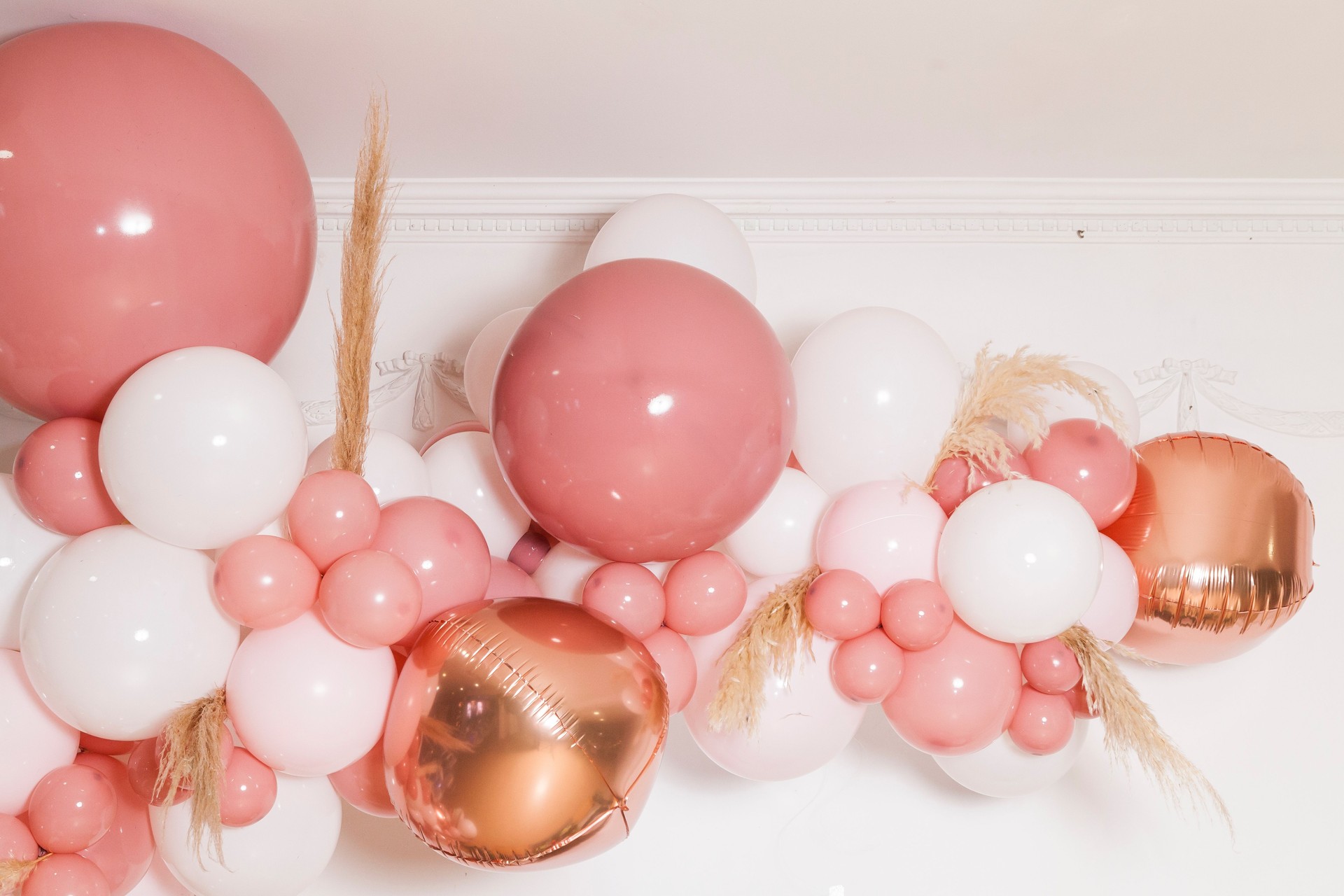 Arch of pink and white balloons; Birthday party decoration for a girl.